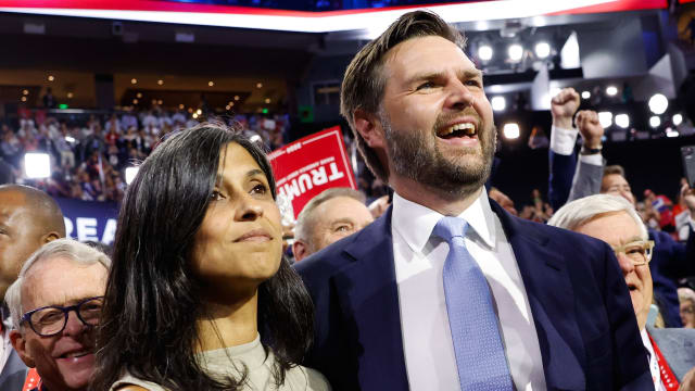 U.S. Sen. J.D. Vance (R-OH) and  his wife Usha Chilukuri Vance look on as he is nominated for the office of Vice President on the first day of the Republican National Convention at the Fiserv Forum on July 15, 2024 in Milwaukee, Wisconsin. 