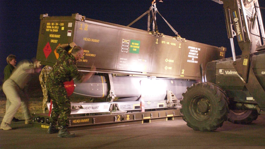 A Storm Shadow missile is prepared for loading to a Royal Air Force Tornado GR4 aircraft in the Gulf in support of Operation TELIC, March 21, 2003. 