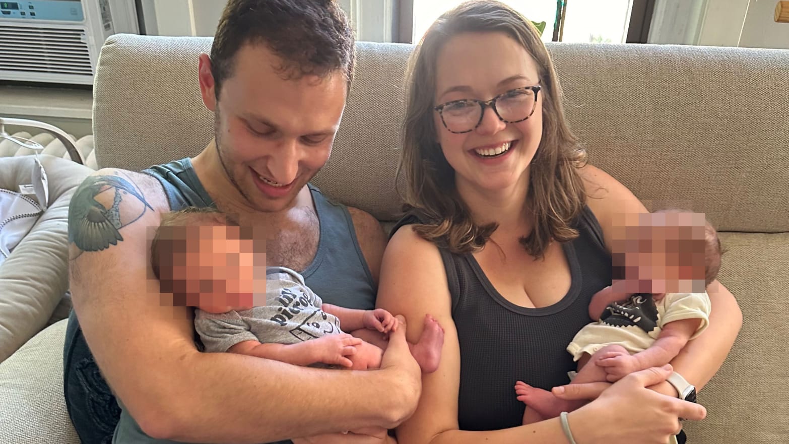 New parents Savannah Roberts and Ethan Katz with their twins, one of whom was allegedly killed this week.