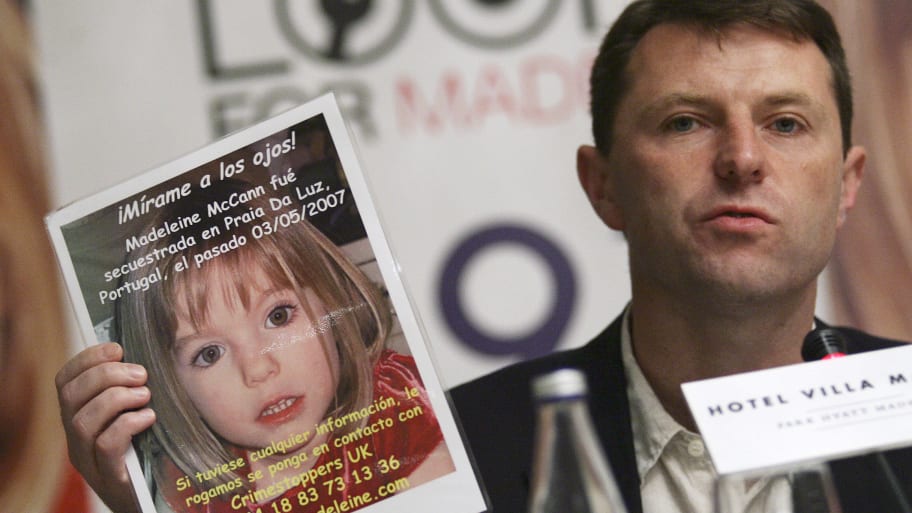 Gerry McCann, father of Madeleine McCann, shows a photo of his daughter during a news conference at a Madrid hotel, June 1, 2007.