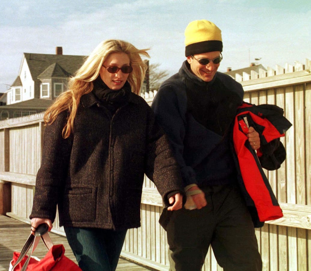 Carolyn Bessette-Kennedy and John F. Kennedy Jr. walk from the airport in Hyannisport, Massachusetts on June 15, 1997.