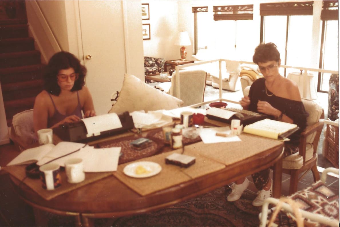 Gloria, right, and Veronica typing their notes for their play during their writing retreat.