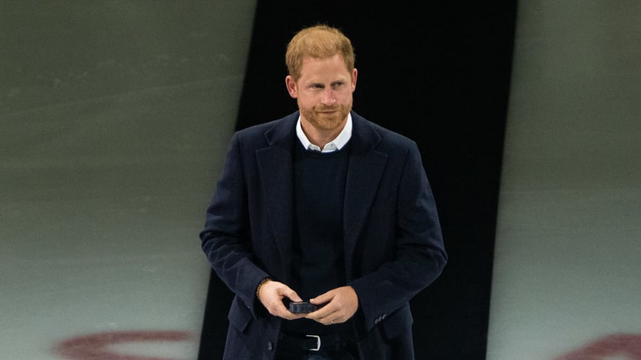 Prince Harry walks on to the ice for a ceremonial puck drop before an NHL game