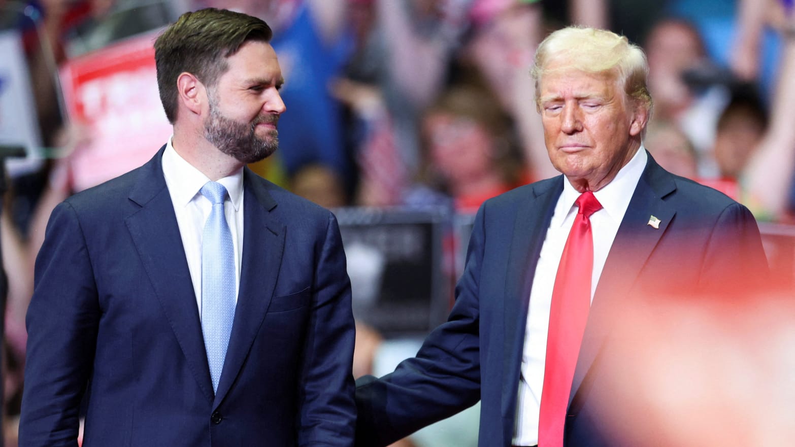 Republican presidential nominee and former U.S. President Donald Trump stands with Republican vice presidential nominee U.S. Senator J.D. Vance (R-OH), as he holds a rally for the first time with his running mate, in Grand Rapids, July 20, 2024.