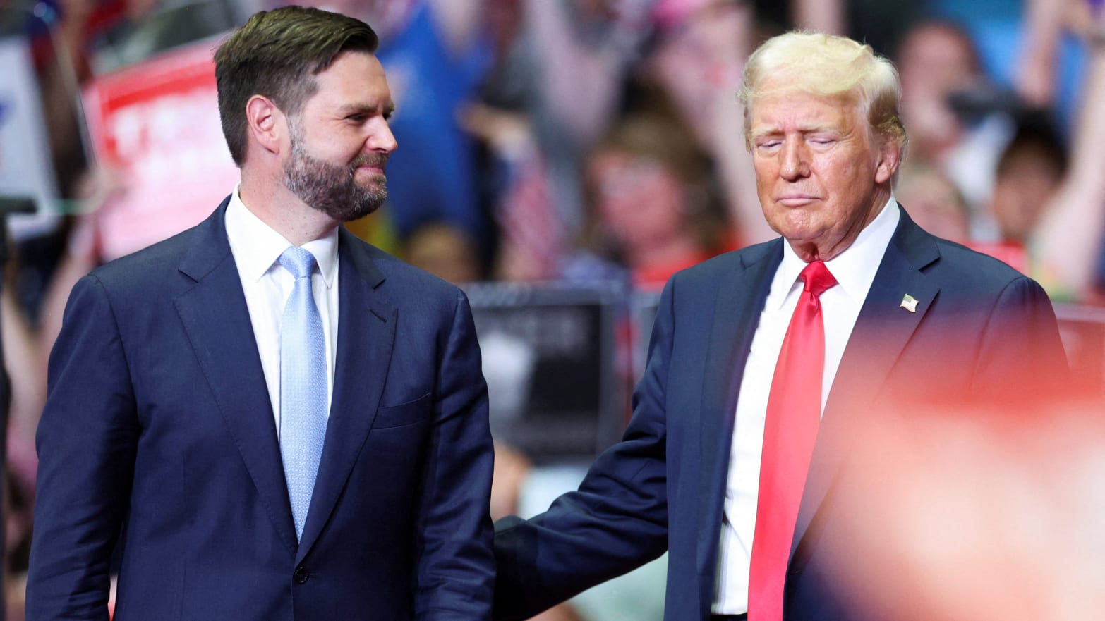 Former U.S. President Donald Trump stands with Republican vice presidential nominee U.S. Senator J.D. Vance (R-OH), as he holds a rally for the first time with his running mate, in Grand Rapids, Michigan, July 20, 2024. 