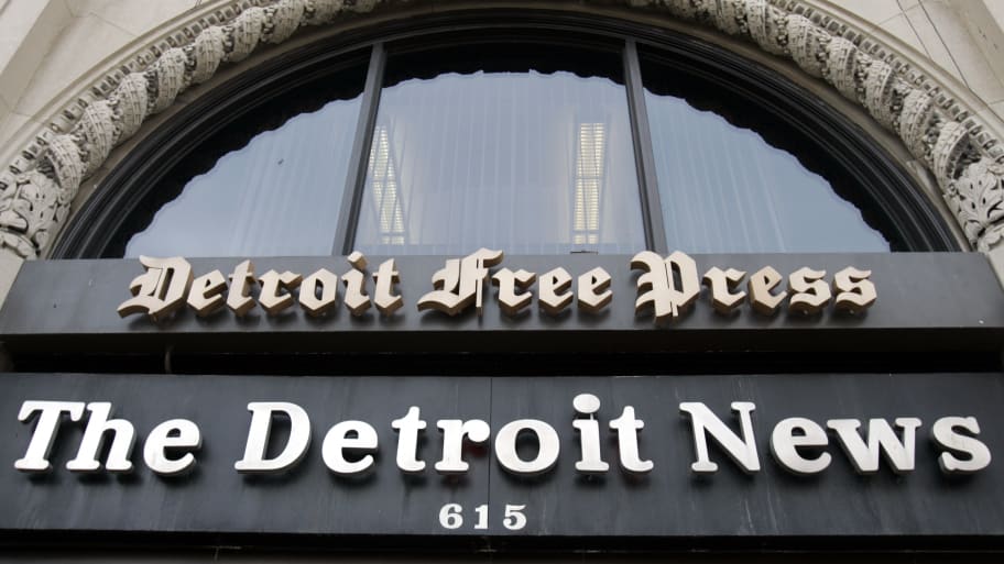 The Detroit News and Detroit Free Press signs are seen above the entrance to the newspapers building in Detroit, Michigan