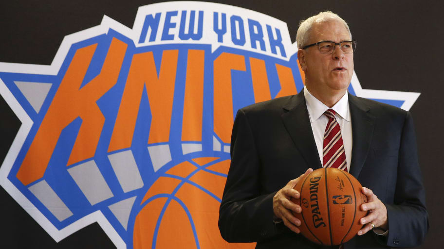 Phil Jackson poses during a news conference announcing him as the team president of the New York Knicks basketball team at Madison Square Gardens in New York March 18, 2014.