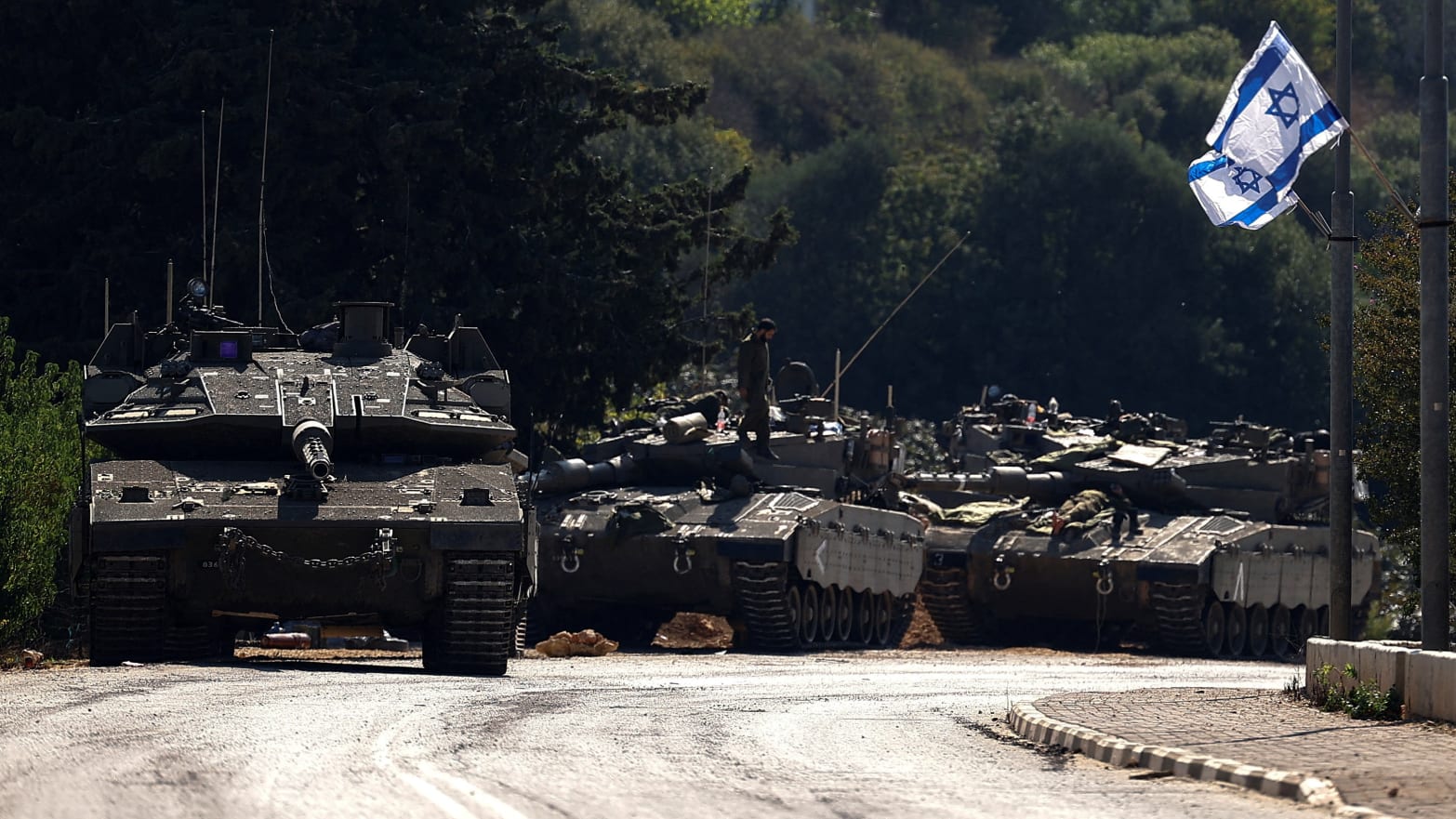 Israeli tanks are seen on a road near Israel's border with Lebanon, in northern Israel, October 12, 2023.