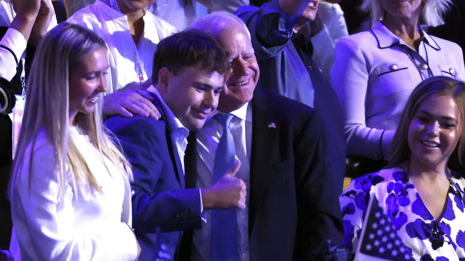 Democratic vice presidential nominee Minnesota Gov. Tim Walz poses for a photo with his son Gus Walz