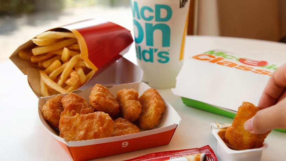 Chicken McNuggets and French fries from a cardboard box, recorded at a McDonald’s branch.