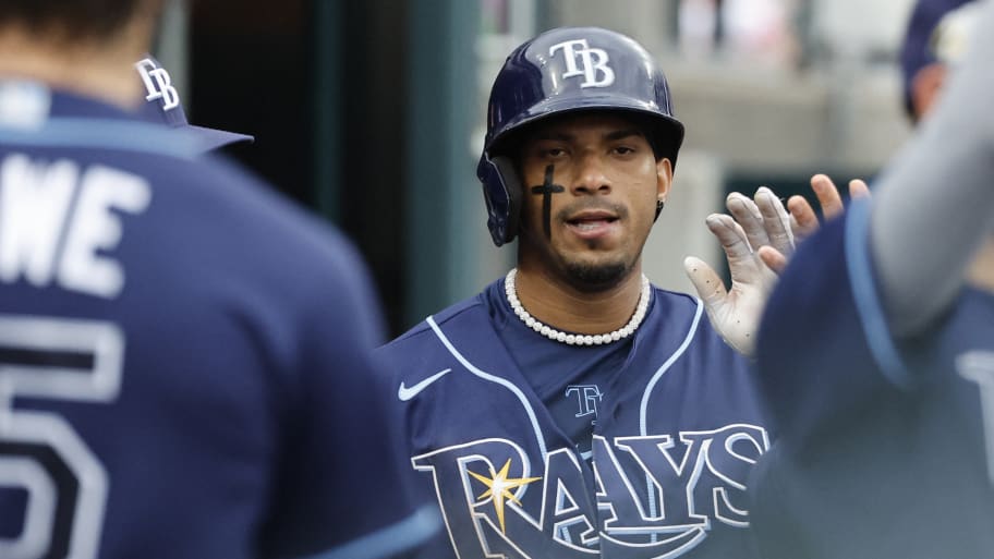 Tampa Bay Rays shortstop Wander Franco (5) receives congratulations from teammates after scoring in the sixth inning against the Detroit Tigers at Comerica Park.
