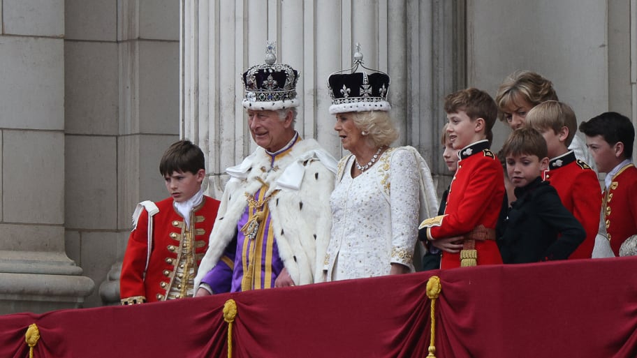 Britain's King Charles III Queen Camilla look on from the Buckingham Palace balcony while viewing the Royal Air Force fly-past in central London on May 6, 2023, after their coronations.