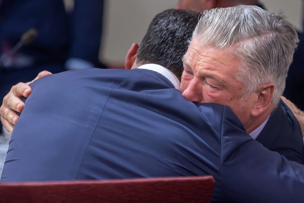 Alec Baldwin hugs one of his attorneys