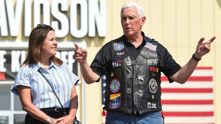 ike Pence, accompanied by his wife Karen Pence, speaks at the Roast and Ride event.