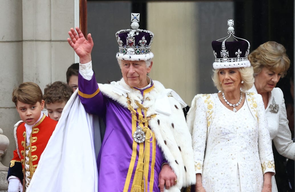 King Charles and Queen Camilla stand on the Buckingham Palace balcony following their coronation ceremony in London, Britain May 6, 2023.