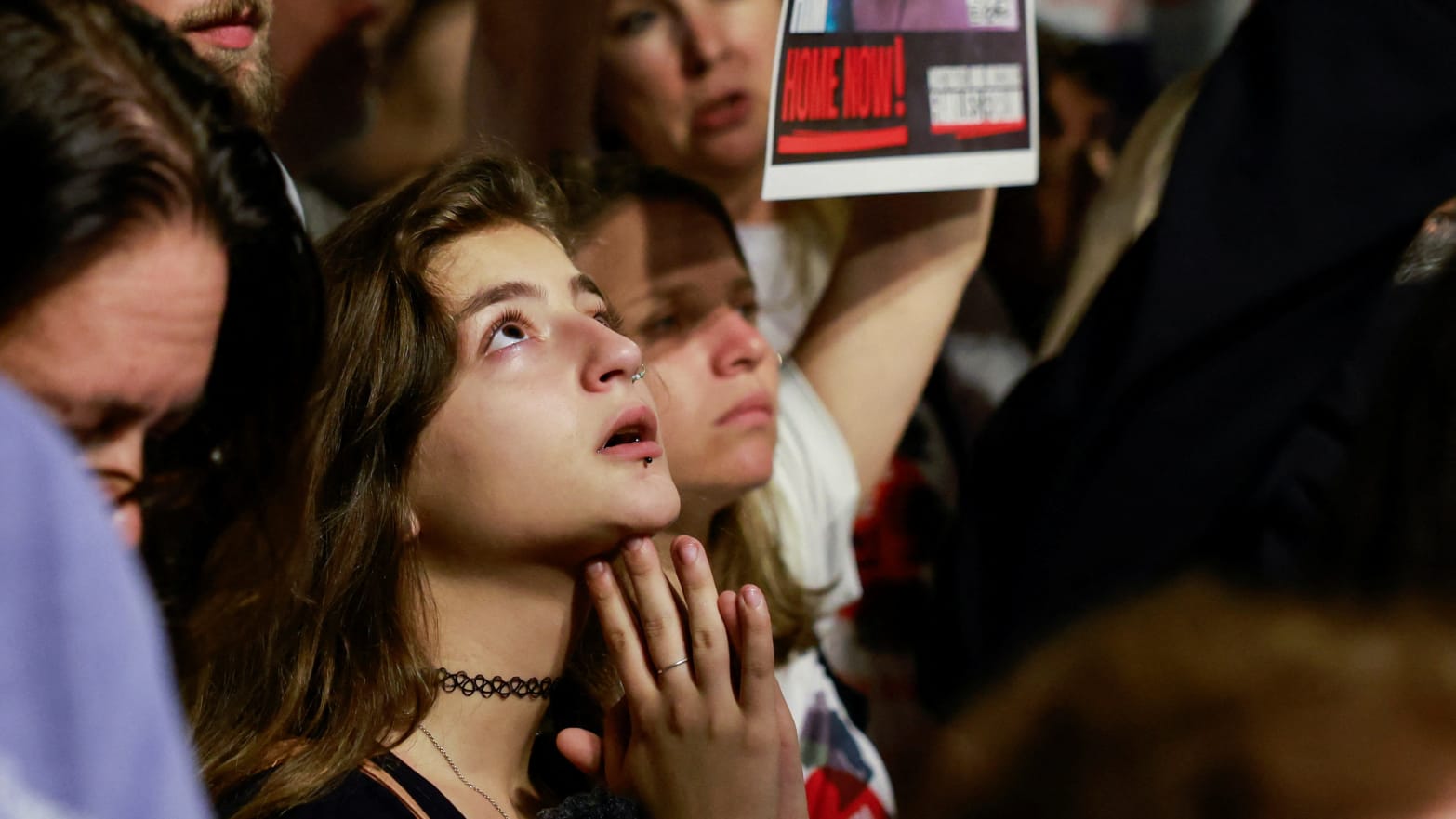 A woman looks on during a protest calling for the immediate release of hostages held in Gaza who were seized from southern Israel on October 7 by Hamas gunmen during a deadly attack, in Tel Aviv, Israel, 
