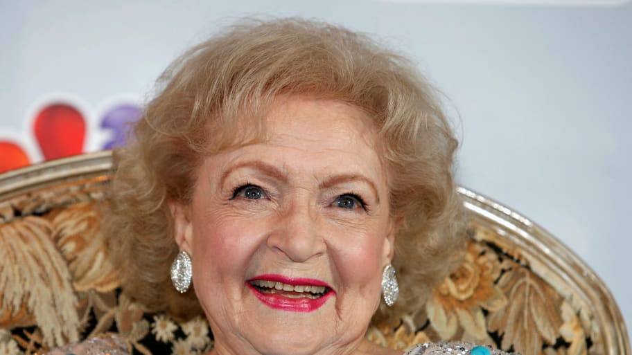 Betty White poses for a photo at a news conference.