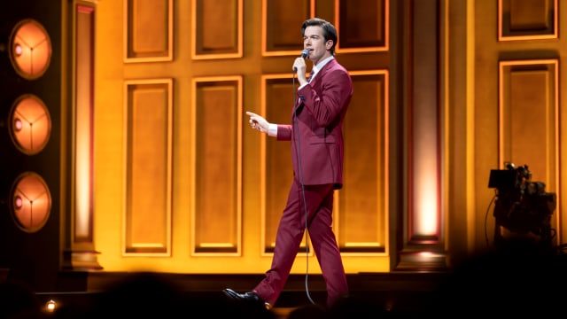 John Mulaney on stage performing "Baby J" at the Boston Symphony Hall