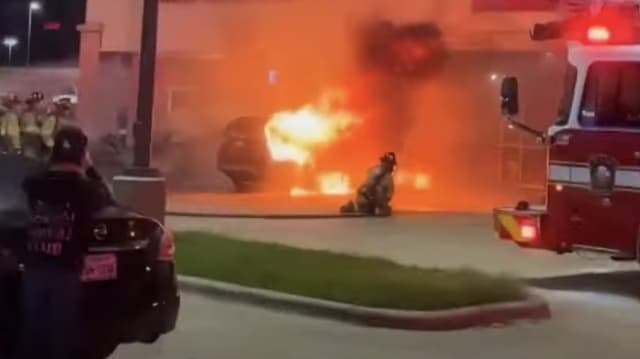 Fire after a small plane crash at a shopping center parking lot in Plano, Texas. 