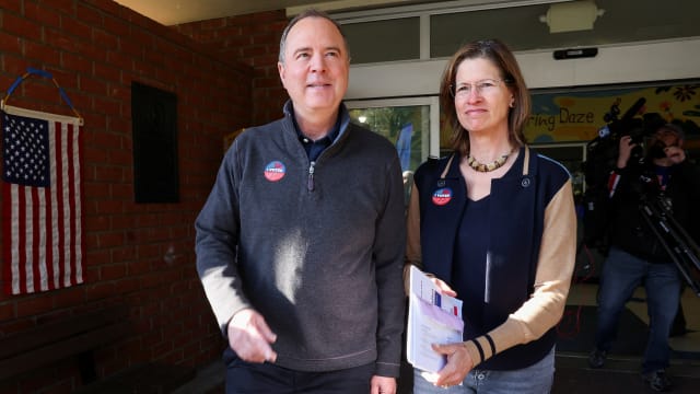 Democratic U.S. Senate candidate and U.S. Representative Adam Schiff (D-CA) walks with his wife Eve after they voted during Super Tuesday primary election in Burbank, California.