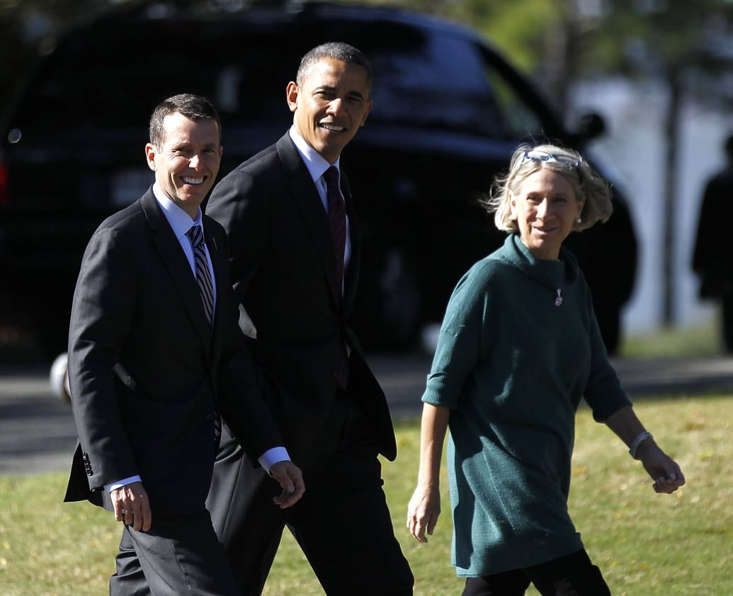 David Plouffe walks alongside Barack Obama.