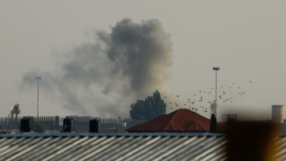 Smoke rises from Israeli strikes at border with Egypt.