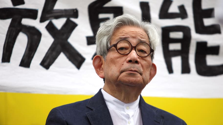 Japanese Nobel literature prize winner Kenzaburo Oe sits in front of a banner reading “radiation” during an anti-nuclear gathering in Tokyo, Japan, Sept. 19, 2011.