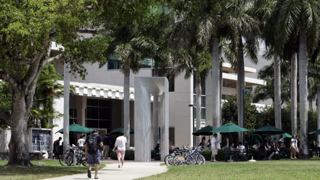 Students walk on the campus of the University of Miami.