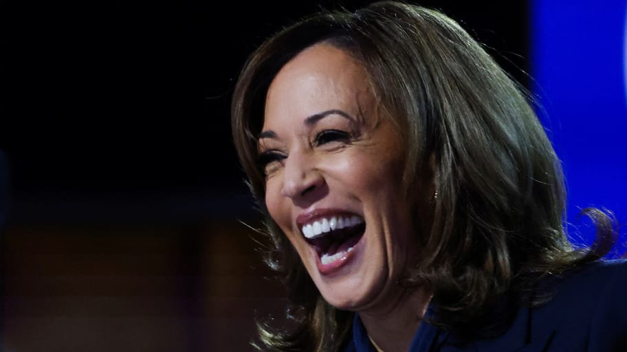 Kamala Harris laughs while on stage at DNC.