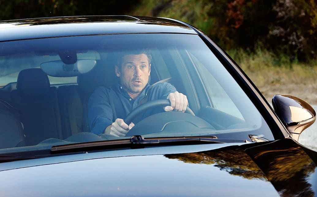 Patrick Dempsey drives a car in a still from 'Grey's Anatomy'