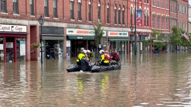 Emergency services work following flooding in Montpelier, Vermont.