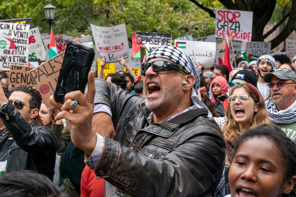 A photo including Protesters during a rally in support of Palestinians 