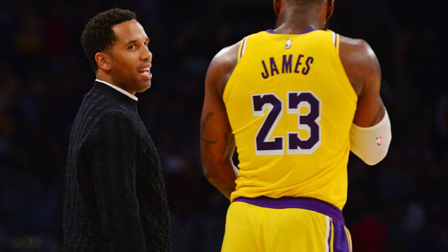 Los Angeles Lakers forward LeBron James (23) speaks with businessman Maverick Carter.