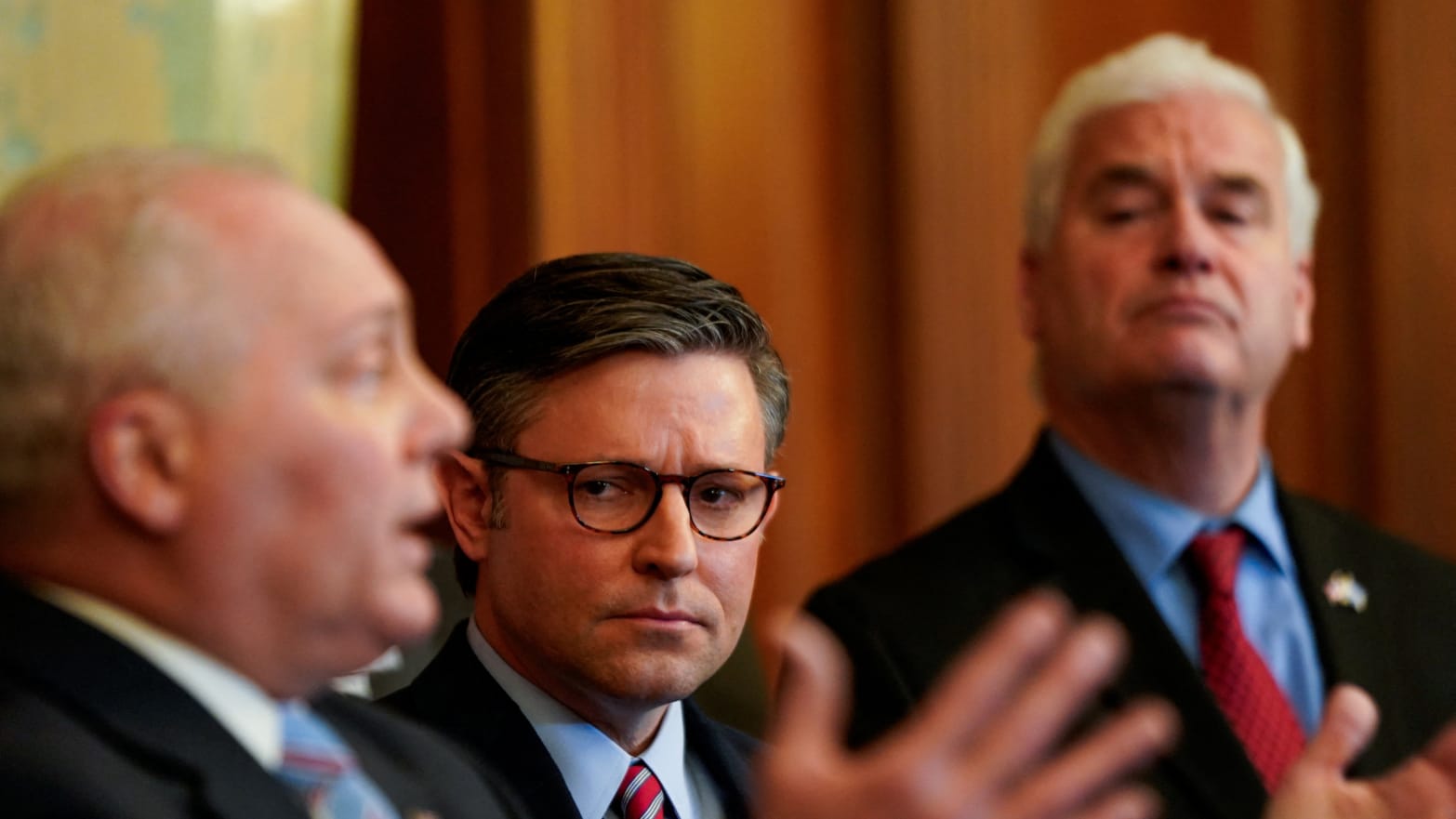 Speaker Mike Johnson (R-LA) and Majority Whip Tom Emmer (R-MN) listen as House Majority Whip Steve Scalise (R-LA) speaks during a press conference about an impeachment inquiry into President Joe Biden.