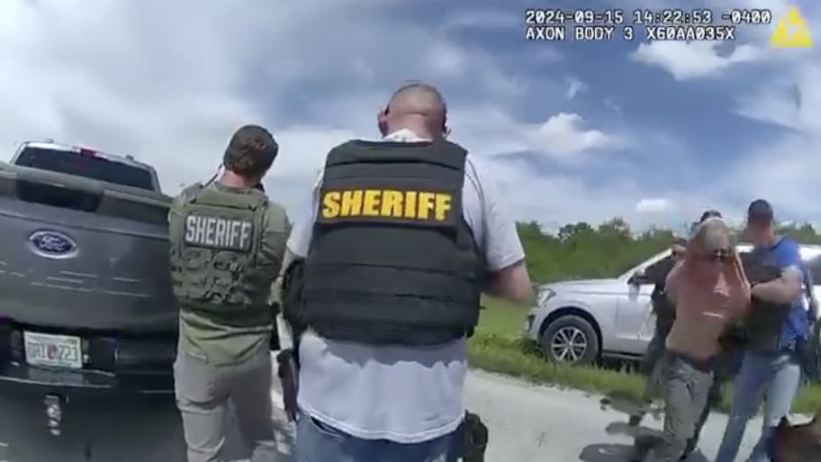 A screenshot from body camera footage showing the apprehension of Ryan Routh.