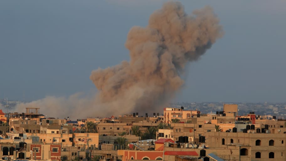  Smoke rises after an Israeli airstrike on the eighth day of the clashes in Rafah, Gaza on October 14.