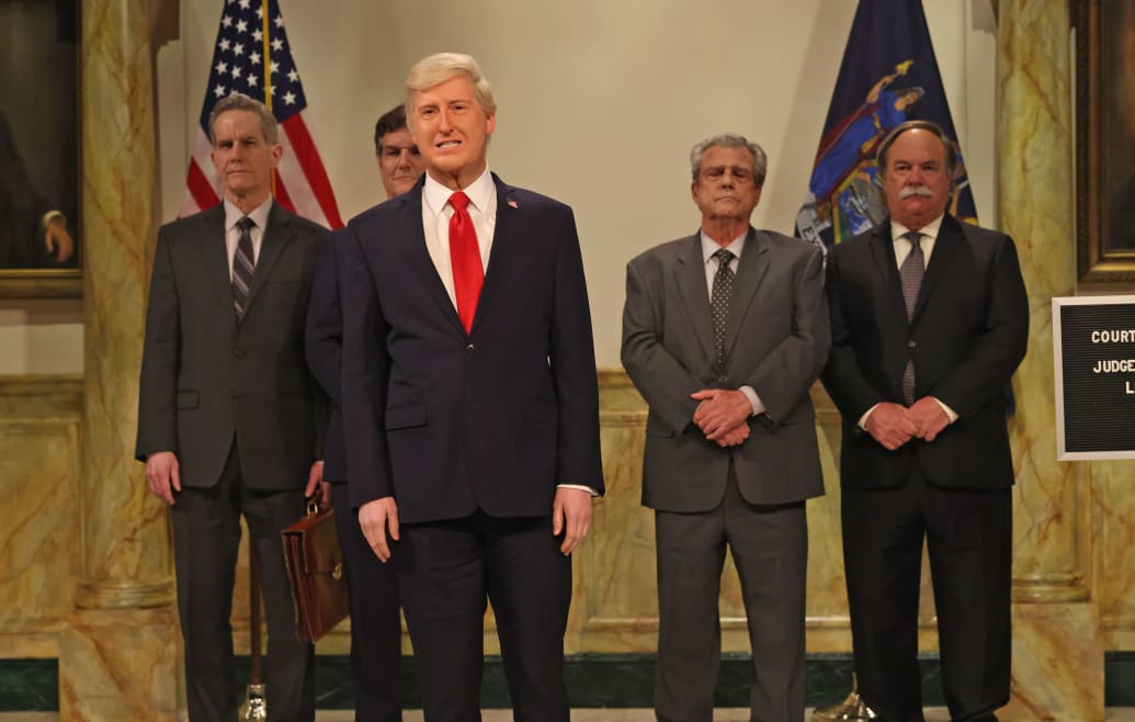 James Austin Johnson as Donald Trump smiles in a sketch from SNL.