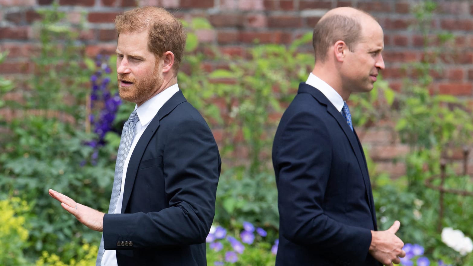 Prince Harry, left, and Prince William attend the unveiling of a statue of their mother, Princess Diana at The Sunken Garden in Kensington Palace, London on July 1, 2021, which would have been her 60th birthday.