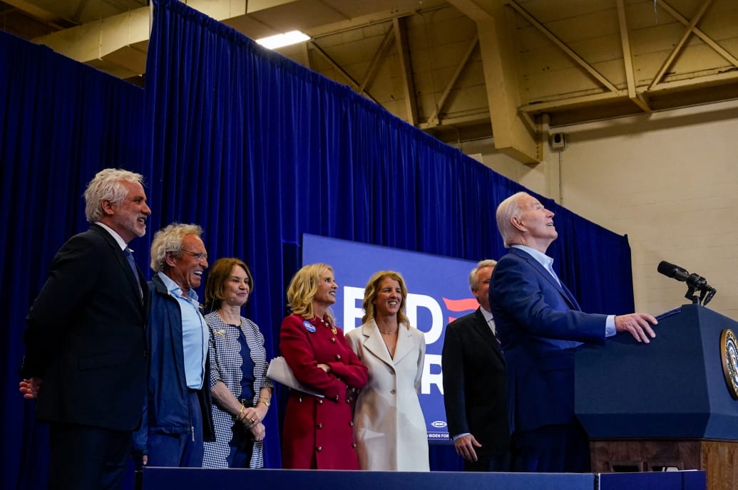 President Joe Biden speaks as members of the Kennedy family stand on stage, at a campaign event on Apr. 18, 2024.