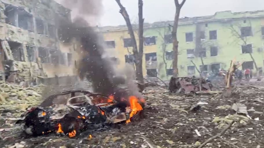 A car burns after the destruction of Mariupol children’s hospital, March 9, 2022.