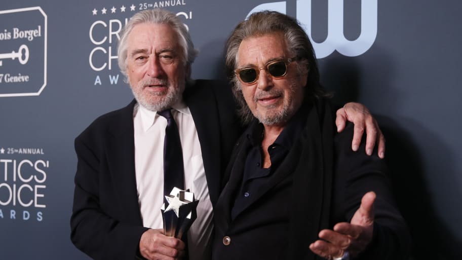 Robert De Niro and Al Pacino pose backstage with their Best Acting Ensemble award for “The Irishman.”