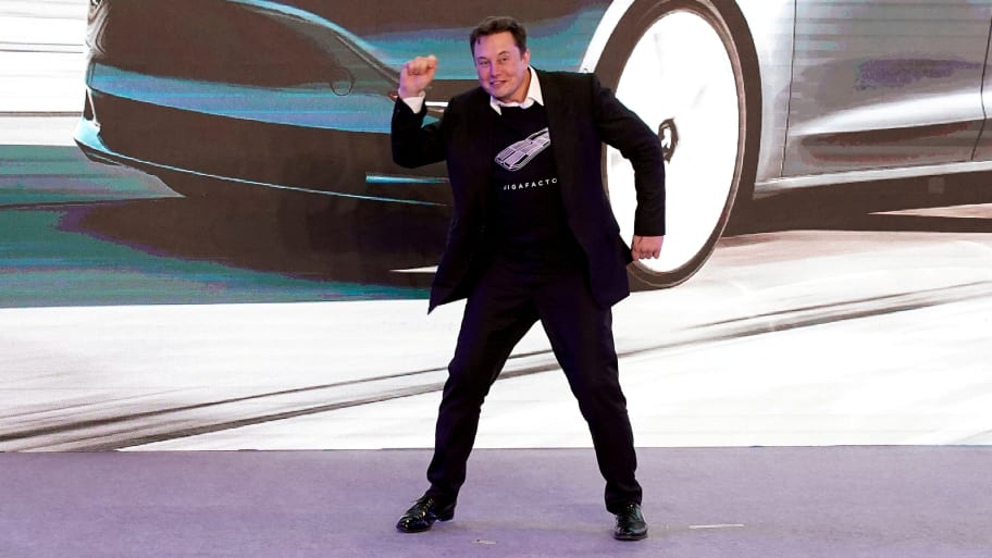 Elon Musk dances onstage during a delivery event for Tesla China-made Model 3 cars in Shanghai, China, Jan. 7, 2020.