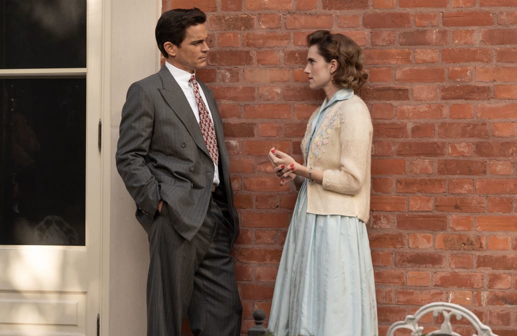 Matt Bomer talks to Allison Williams outside of a house in a still from 'Fellow Travelers'