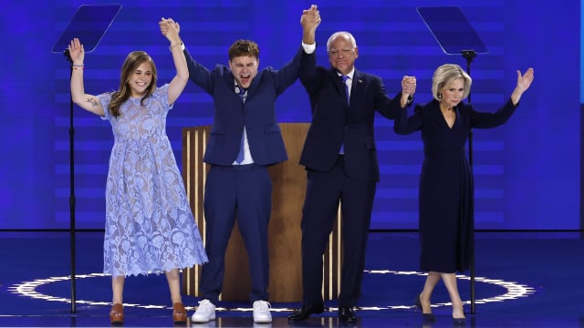 Hope, Gus, Tim and Gwen Walz on stage at the DNC