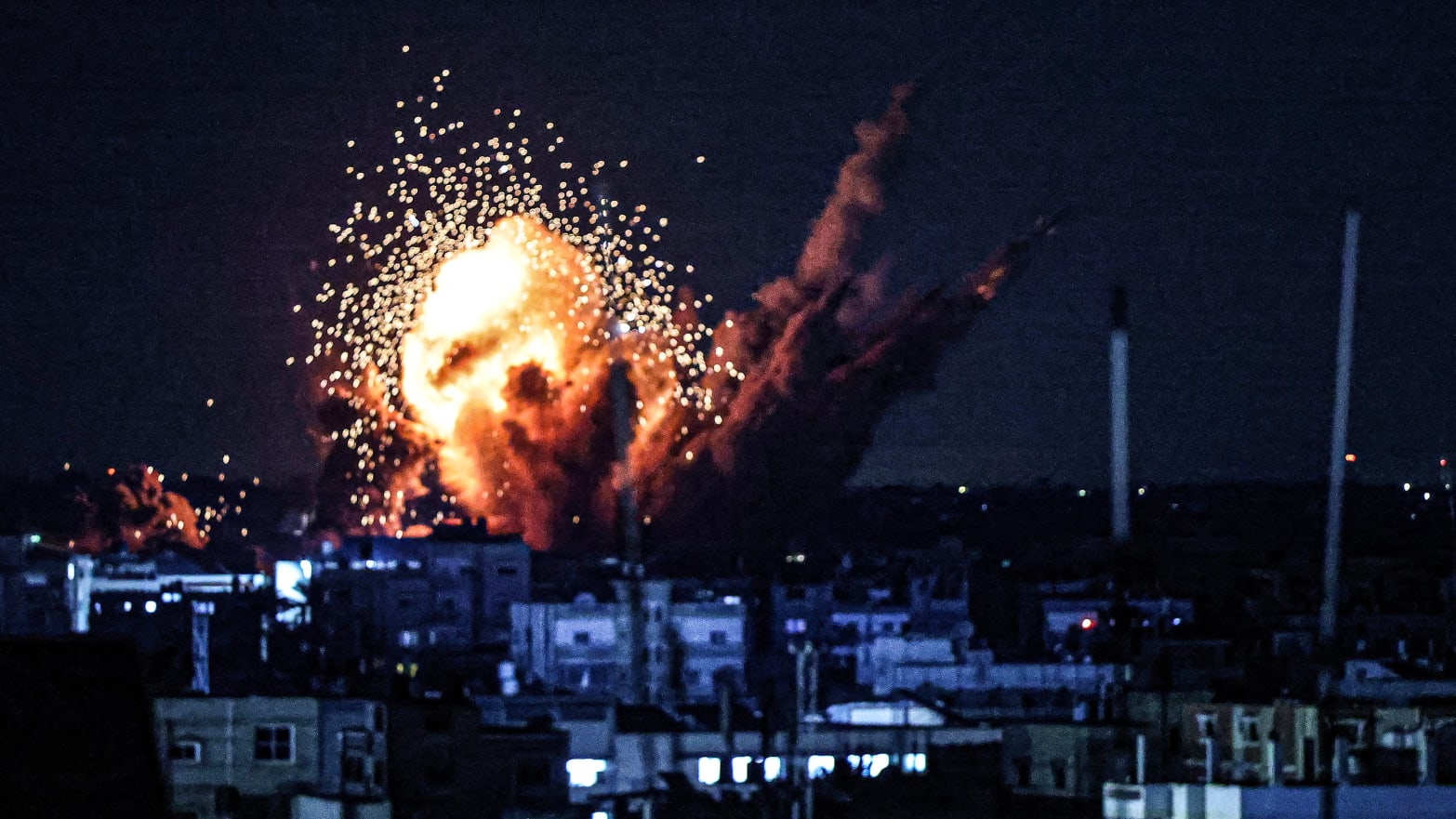 A ball of fire and smoke rise above buildings during an Israeli strike on Rafah in the southern Gaza Strip,