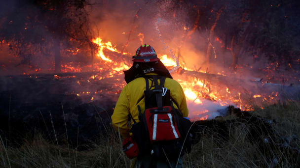 Firefighters battle a wildfire near Santa Rosa, California, U.S., October 14, 2017.