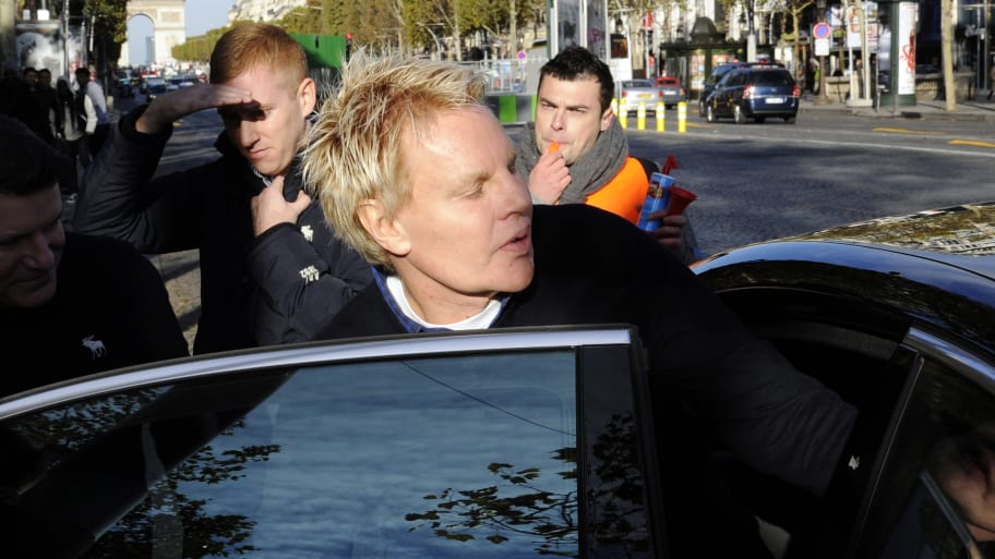 Mike Jeffries, CEO of US clothing retailer Abercrombie & Fitch leaves the store on the Champs Elysees avenue in Paris