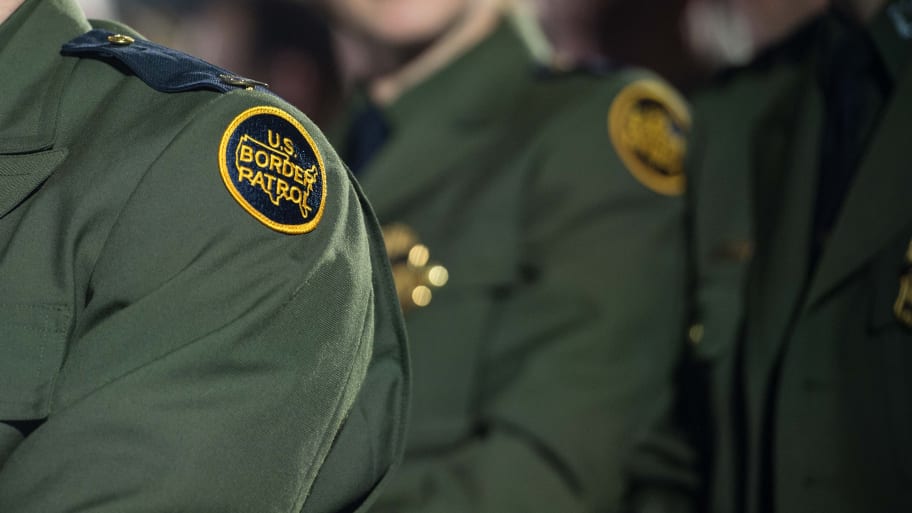 A US Border Patrol officer's patch is seen on the shoulder of his uniform.