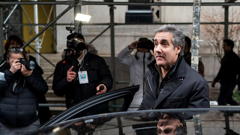 Michael Cohen steps into a car outside a New York Courthouse.