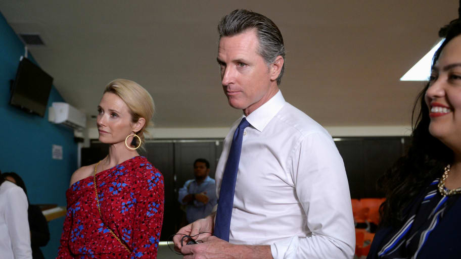 Governor of U.S. state of California Gavin Newsom and his wife Jennifer Siebel Newsom visit the premises of a migrant assistance office in San Salvador.